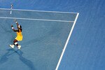MELBOURNE, AUSTRALIA - JANUARY 30:  Serena Williams of the United States of America throws her racquet into the air after winning championship point in her women's final match against Justine Henin of Belgium during day thirteen of the 2010 Australian Open at Melbourne Park on January 30, 2010 in Melbourne, Australia.  (Photo by Ryan Pierse/Getty Images)
