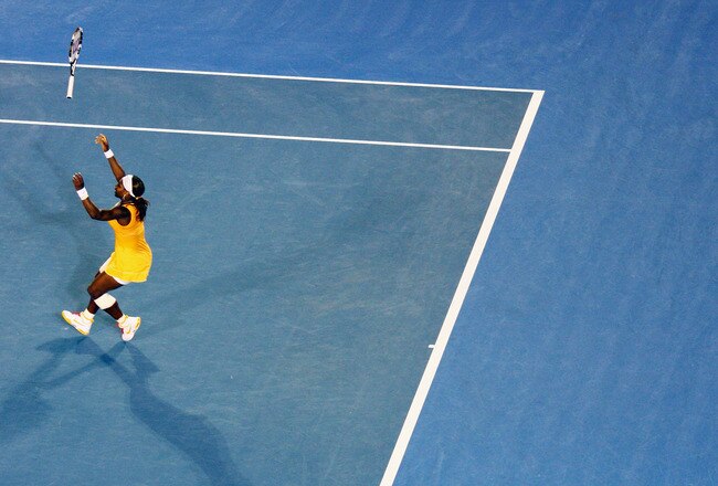 MELBOURNE, AUSTRALIA - JANUARY 30:  Serena Williams of the United States of America throws her racquet into the air after winning championship point in her women's final match against Justine Henin of Belgium during day thirteen of the 2010 Australian Open at Melbourne Park on January 30, 2010 in Melbourne, Australia.  (Photo by Ryan Pierse/Getty Images)