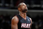 WASHINGTON, DC - DECEMBER 18:  Dwyane Wade #3 of the Miami Heat rests during a break in the game against the Washington Wizards at the Verizon Center on December 18, 2010 in Washington, DC. NOTE TO USER: User expressly acknowledges and agrees that, by downloading and or using this Photograph, user is consenting to the terms and conditions of the Getty Images License Agreement.   (Photo by Greg Fiume/Getty Images)