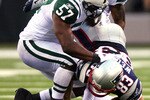EAST RUTHERFORD, NJ - SEPTEMBER 19:  Wes Welker #83 of the New England Patriots is tackled by Bart Scott #57 of the New York Jets at the New Meadowlands Stadium on September 19, 2010 in East Rutherford, New Jersey. The Jets defeated the Patriots 28 - 14. (Photo by Andrew Burton/Getty Images)