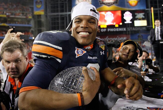 GLENDALE, AZ - JANUARY 10:  Quarterback Cameron Newton #2 of the Auburn Tigers celebrates the Tigers 22-19 victory against the Oregon Ducks in the Tostitos BCS National Championship Game at University of Phoenix Stadium on January 10, 2011 in Glendale, Arizona.  (Photo by Kevin C. Cox/Getty Images)