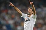 MADRID, SPAIN - SEPTEMBER 17:  Ruud van Nistelrooy of Real Madrid celebrates scoring the second goal during the UEFA Champions League Group H match between Real Madrid and BATE Borisov at the Santiago Bernabeu stadium on September 17, 2008 in Madrid, Spain.  (Photo by Jasper Juinen/Getty Images)