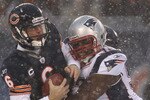 CHICAGO, IL - DECEMBER 12: Jay Cutler #6 of the Chicago Bears is sacked by Gerard Warren #92 of the New England Patriots at Soldier Field on December 12, 2010 in Chicago, Illinois.  The Patriots defeated the Bears 36-7. (Photo by Jonathan Daniel/Getty Images)