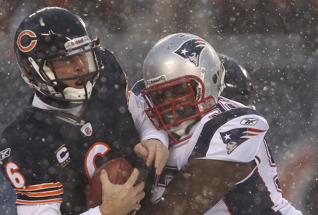 CHICAGO, IL - DECEMBER 12: Jay Cutler #6 of the Chicago Bears is sacked by Gerard Warren #92 of the New England Patriots at Soldier Field on December 12, 2010 in Chicago, Illinois.  The Patriots defeated the Bears 36-7. (Photo by Jonathan Daniel/Getty Images)
