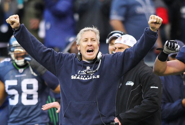 SEATTLE, WA - JANUARY 08: Head coach Pete Carroll and Will Herring #54 of the Seattle Seahawks celebrate a fourth down stop by the Seahawks in the third quarter against the New Orleans Saints during the 2011 NFC wild-card playoff game at Qwest Field on January 8, 2011 in Seattle, Washington. (Photo by Jonathan Ferrey/Getty Images)