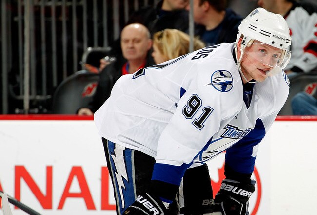 NEWARK, NJ - JANUARY 09:  Steven Stamkos #91 of the Tampa Bay Lightning waits for a faceoff during an NHL hockey game against the New Jersey Devils at the Prudential Center on January 9, 2011 in Newark, New Jersey.  (Photo by Paul Bereswill/Getty Images)