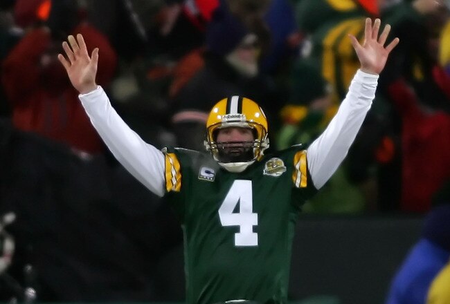 GREEN BAY, WI - JANUARY 20:  Quarterback Brett Favre #4 of the Green Bay Packers celebrates after throwing a 90 yard touchdown reception against the New York Giants during the NFC championship game on January 20, 2008 at Lambeau Field in Green Bay, Wisconsin.  (Photo by Jonathan Ferrey/Getty Images)
