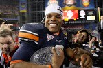 GLENDALE, AZ - JANUARY 10:  Quarterback Cameron Newton #2 of the Auburn Tigers celebrates the Tigers 22-19 victory against the Oregon Ducks in the Tostitos BCS National Championship Game at University of Phoenix Stadium on January 10, 2011 in Glendale, Arizona.  (Photo by Kevin C. Cox/Getty Images)