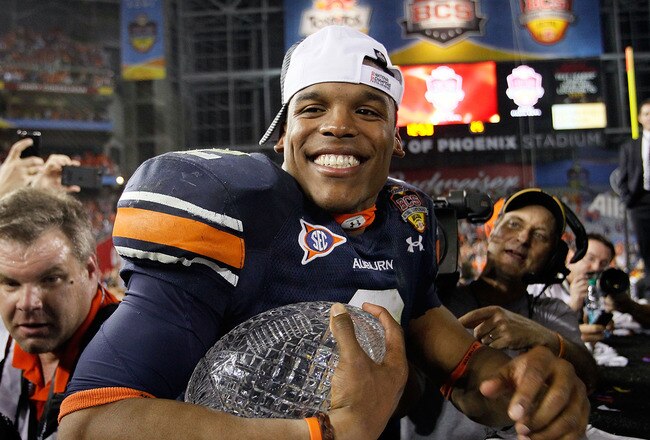 GLENDALE, AZ - JANUARY 10:  Quarterback Cameron Newton #2 of the Auburn Tigers celebrates the Tigers 22-19 victory against the Oregon Ducks in the Tostitos BCS National Championship Game at University of Phoenix Stadium on January 10, 2011 in Glendale, Arizona.  (Photo by Kevin C. Cox/Getty Images)