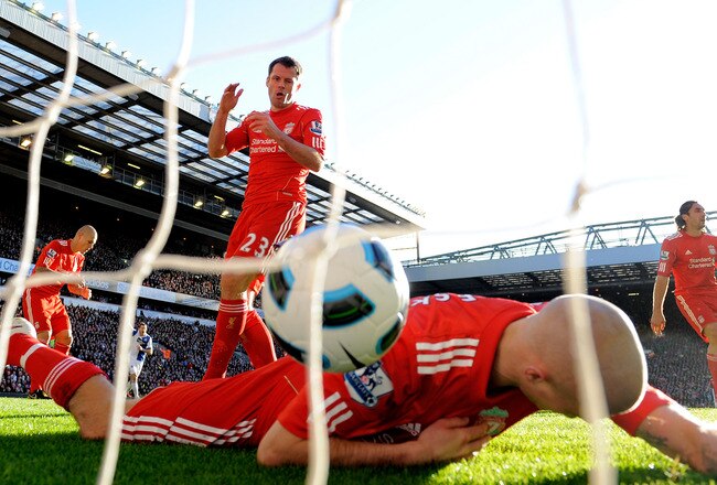 LIVERPOOL, ENGLAND - OCTOBER 24:  Jamie Carragher of Liverpool looks dejected after scoring an own goal during the Barclays Premier League match between Liverpool and Blackburn Rovers at Anfield on October 24, 2010 in Liverpool, England.  (Photo by Michael Regan/Getty Images)