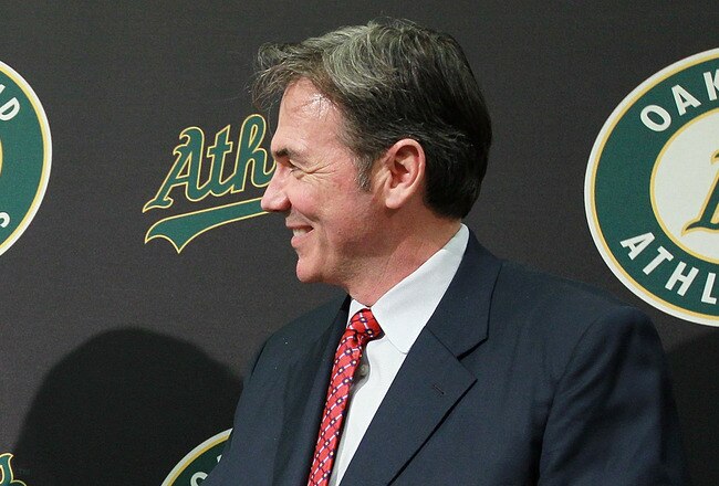 OAKLAND, CA - DECEMBER 14:  Hideki Matsui (L) shakes hands with Oakland Athletics general manager Billy Beane (R) after trying on his new jersey during a press conference where he was introduced as the newest member of the Oakland Athletics at Oakland-Alameda County Coliseum on December 14, 2010 in Oakland, California.  The Oakland Athletics signed designated hitter Hideki Matsui to a one-year deal worth $4.25 million plus possible incentives for the 2011 season.  (Photo by Justin Sullivan/Getty Images)