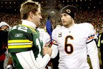 GREEN BAY, WI - JANUARY 02:  Quarterback Aaron Rodgers #12 of the Green Bay Packers is congratukated by quarterback Jay Cutler #6 of the Chicago Bears at Lambeau Field on January 2, 2011 in Green Bay, Wisconsin.  (Photo by Matthew Stockman/Getty Images)