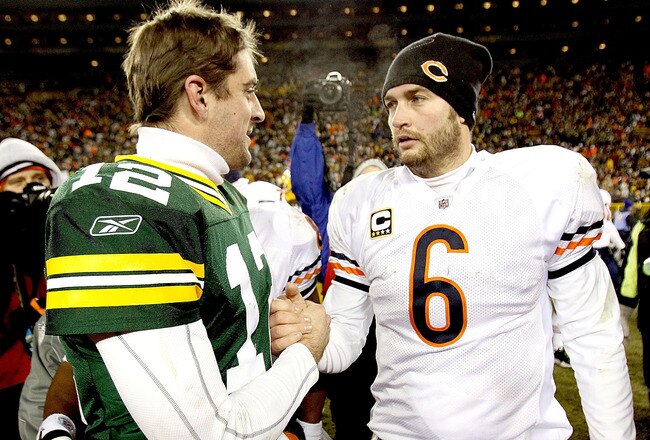 GREEN BAY, WI - JANUARY 02:  Quarterback Aaron Rodgers #12 of the Green Bay Packers is congratukated by quarterback Jay Cutler #6 of the Chicago Bears at Lambeau Field on January 2, 2011 in Green Bay, Wisconsin.  (Photo by Matthew Stockman/Getty Images)