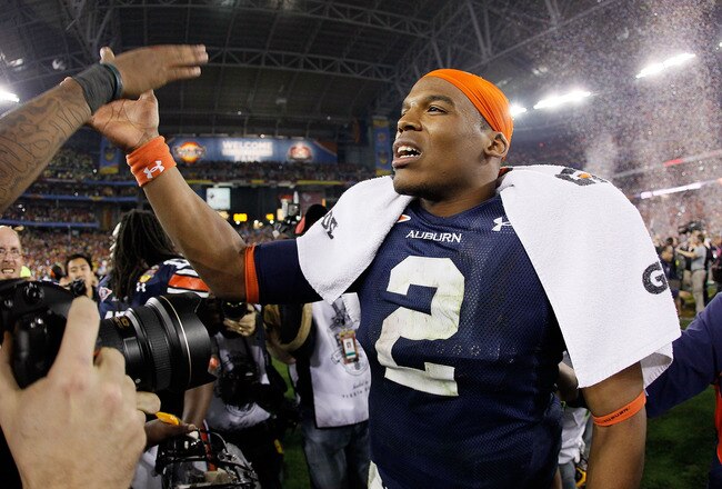 GLENDALE, AZ - JANUARY 10:  Quarterback Cameron Newton #2 of the Auburn Tigers celebrates the Tigers 22-19 victory against the Oregon Ducks in the Tostitos BCS National Championship Game at University of Phoenix Stadium on January 10, 2011 in Glendale, Arizona.  (Photo by Kevin C. Cox/Getty Images)