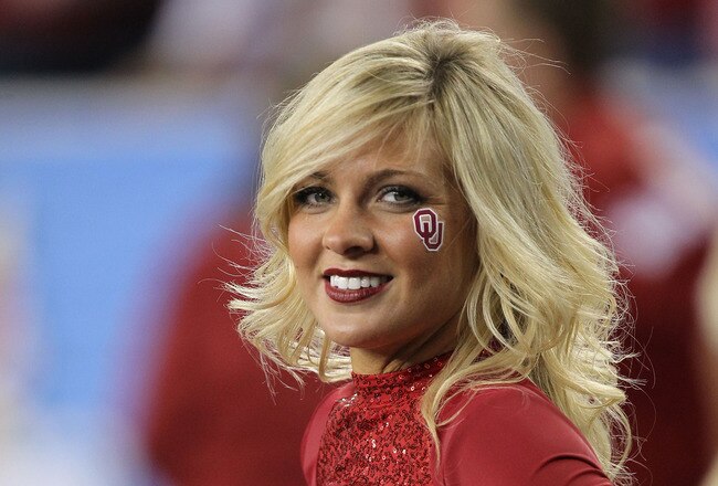 GLENDALE, AZ - JANUARY 01:  An Oklahoma Sooners cheerleader looks on as the football team takes on Connecticut Huskies during the Tostitos Fiesta Bowl at the Universtity of Phoenix Stadium on January 1, 2011 in Glendale, Arizona.  (Photo by Ronald Martinez/Getty Images)