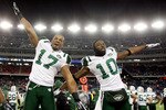 FOXBORO, MA - JANUARY 16:  Braylon Edwards #17 and Santonio Holmes #10 of the New York Jets celebrate on their way to defeating the New England Patriots 28 to 21 victory over the New England Patriots during their 2011 AFC divisional playoff game at Gillette Stadium on January 16, 2011 in Foxboro, Massachusetts.  (Photo by Al Bello/Getty Images)