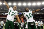 FOXBORO, MA - JANUARY 16:  Braylon Edwards #17 and Santonio Holmes #10 of the New York Jets celebrate on their way to defeating the New England Patriots 28 to 21 victory over the New England Patriots during their 2011 AFC divisional playoff game at Gillette Stadium on January 16, 2011 in Foxboro, Massachusetts.  (Photo by Al Bello/Getty Images)