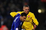 IPSWICH, ENGLAND - JANUARY 12: Carlos Edwards of Ipswich Town is closed down by Kieran Gibbs of Arsenal during the Carling Cup Semi Final First Leg match between Ipswich Town and Arsenal at Portman Road on January 12, 2011 in Ipswich, England.  (Photo by Jamie McDonald/Getty Images)