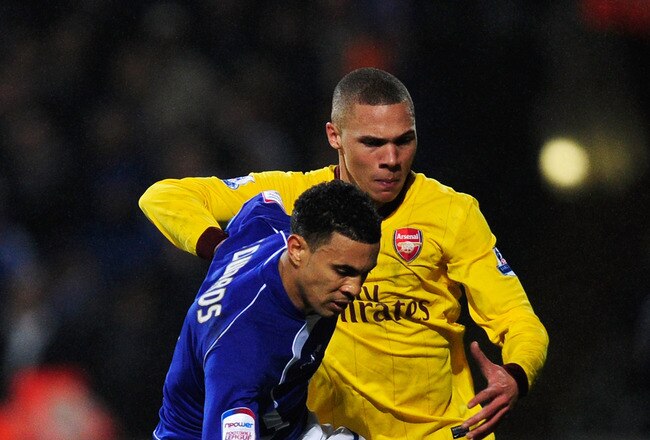 IPSWICH, ENGLAND - JANUARY 12: Carlos Edwards of Ipswich Town is closed down by Kieran Gibbs of Arsenal during the Carling Cup Semi Final First Leg match between Ipswich Town and Arsenal at Portman Road on January 12, 2011 in Ipswich, England.  (Photo by Jamie McDonald/Getty Images)