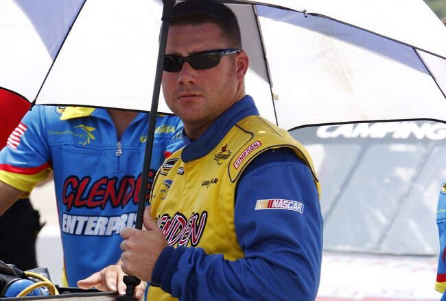 MEMPHIS, TN - JUNE 27: Chris Fontaine, driver of the #84 Glenden Enterprises Chevrolet tries to stay cool as he stands on pit road during qualifying for the MemphisTravel.com 200 Camping World Truck Series race at the Memphis Motorsports Park on June 27, 2009 in Memphis, Tennessee.   (Photo by John Sommers II/Getty Images)