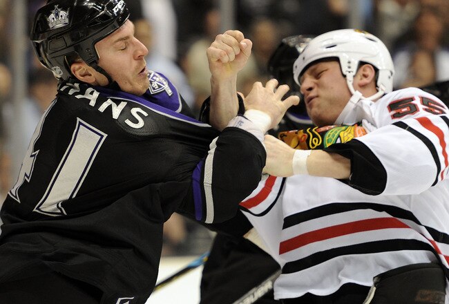 LOS ANGELES, CA - MARCH 18:  Raitis Ivanans #41 of the Los Angeles Kings takes an uppercut from Ben Eager #55 of the Chicago Blackhawks during the third period at the Staples Center on March 18, 2010 in Los Angeles, California.  (Photo by Harry How/Getty Images)