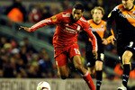 LIVERPOOL, ENGLAND - DECEMBER 15:  Ryan Babel of Liverpool is pursued by Michael Silberbauer of FC Utrecht during the UEFA Europa League Group K match between Liverpool and FC Utrecht at Anfield on December 15, 2010 in Liverpool, England.  (Photo by Clint Hughes/Getty Images)