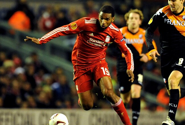 LIVERPOOL, ENGLAND - DECEMBER 15:  Ryan Babel of Liverpool is pursued by Michael Silberbauer of FC Utrecht during the UEFA Europa League Group K match between Liverpool and FC Utrecht at Anfield on December 15, 2010 in Liverpool, England.  (Photo by Clint Hughes/Getty Images)