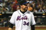 NEW YORK - SEPTEMBER 28:  Mike Pelfrey #34 of the New York Mets walks back to the dugout after pitching for eight innings against the Milwaukee Brewers on September 28, 2010 at Citi Field in the Flushing neighborhood of the Queens borough of New York City.  (Photo by Andrew Burton/Getty Images)
