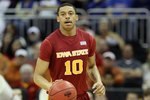 KANSAS CITY, MO - MARCH 10:  Diante Garrett #10 of the Iowa State Cyclones moves the ball against the Texas Longhorns during the first round game of the 2010 Phillips 66 Big 12 Men's Basketball Tournament at the Sprint Center on March 10, 2010 in Kansas City, Missouri.  (Photo by Jamie Squire/Getty Images)