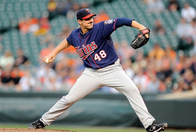 BALTIMORE - JULY 22:  Carl Pavano #48 of the Minnesota Twins pitches against the Baltimore Orioles at Camden Yards on July 22, 2010 in Baltimore, Maryland.  (Photo by Greg Fiume/Getty Images)