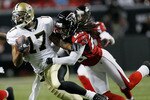 ATLANTA, GA - DECEMBER 27:  Robert Meachem #17 of the New Orleans Saints fights off the tackle of Atlanta Falcons defender Dunta Robinson #23  in the first half during their game at the Georgia Dome on December 27, 2010 in Atlanta, Georgia.  (Photo by Kevin C. Cox/Getty Images)