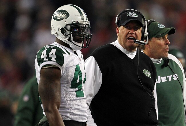 FOXBORO, MA - JANUARY 16:  Head coach Rex Ryan and James Ihedigbo #44 of the New York Jets look on from the sideline during their 2011 AFC divisional playoff game against the New England Patriots at Gillette Stadium on January 16, 2011 in Foxboro, Massachusetts.  (Photo by Jim Rogash/Getty Images)