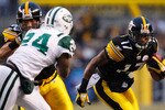 PITTSBURGH - DECEMBER 19:  Mike Wallace #17 of the Pittsburgh Steelers runs around the New York Jets defense after making a catch during the game on December 19, 2010 at Heinz Field in Pittsburgh, Pennsylvania.  (Photo by Jared Wickerham/Getty Images)