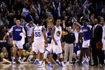 OAKLAND, CA - JANUARY 19:  Monta Ellis #8 of the Golden State Warriors is congratulated by teammates after he made the winning shot with 0.6 seconds left in their game againsts the Indiana Pacers at Oracle Arena on January 19, 2011 in Oakland, California.  NOTE TO USER: User expressly acknowledges and agrees that, by downloading and or using this photograph, User is consenting to the terms and conditions of the Getty Images License Agreement.  (Photo by Ezra Shaw/Getty Images)
