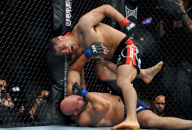 LOS ANGELES, CA - OCTOBER 24:  UFC fighter Cain Velasquez (top) battles with UFC fighter Ben Rothwell (bottom) during their Heavyweight bout at UFC 104: Machida vs. Shogun at Staples Center on October 24, 2009 in Los Angeles, California.  (Photo by Jon Kopaloff/Getty Images)