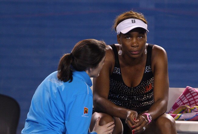 MELBOURNE, AUSTRALIA - JANUARY 21:  Venus Williams of the United States of America receives medical attention in her third round match against Andrea Petkovic of Germany during day five of the 2011 Australian Open at Melbourne Park on January 21, 2011 in Melbourne, Australia.  (Photo by Mark Kolbe/Getty Images)