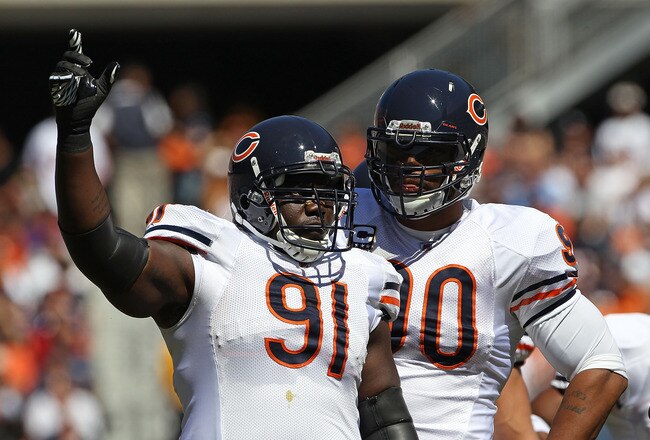 CHICAGO - SEPTEMBER 12: Tommie Harris #91 and Julius Peppers #90 of the Chicago Bears await the start of play against the Detroit Lions during the NFL season opening game at Soldier Field on September 12, 2010 in Chicago, Illinois. The Bears defeated the Lions 19-14. (Photo by Jonathan Daniel/Getty Images)