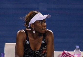 MELBOURNE, AUSTRALIA - JANUARY 21: Venus Williams of the United States of America looks on as she retires hurt due to injury in her third round match against Andrea Petkovic of Germany during day five of the 2011 Australian Open at Melbourne Park on January 21, 2011 in Melbourne, Australia. (Photo by Mark Kolbe/Getty Images)