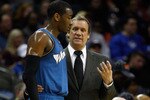 CHARLOTTE, NC - JANUARY 08:  Head coach Flip Saunders and John Wall #2 of the Washington Wizards talk on the sidelines during their game agains the Charlotte Bobcats at Time Warner Cable Arena on January 8, 2011 in Charlotte, North Carolina. NOTE TO USER: User expressly acknowledges and agrees that, by downloading and/or using this Photograph, User is consenting to the terms and conditions of the Getty Images License Agreement.  (Photo by Streeter Lecka/Getty Images)