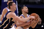 OAKLAND, CA - JANUARY 19:  Stephen Curry #30 of the Golden State Warriors collides with Tyler Hansbrough #50 of the Indiana Pacers at Oracle Arena on January 19, 2011 in Oakland, California.  NOTE TO USER: User expressly acknowledges and agrees that, by downloading and or using this photograph, User is consenting to the terms and conditions of the Getty Images License Agreement.  (Photo by Ezra Shaw/Getty Images)