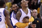OAKLAND, CA - JANUARY 19:  Monta Ellis #8 of the Golden State Warriors is congratulated by teammates after he made the winning shot with 0.6 seconds left in their game againsts the Indiana Pacers at Oracle Arena on January 19, 2011 in Oakland, California.  NOTE TO USER: User expressly acknowledges and agrees that, by downloading and or using this photograph, User is consenting to the terms and conditions of the Getty Images License Agreement.  (Photo by Ezra Shaw/Getty Images)