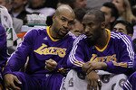 SAN ANTONIO, TX - DECEMBER 28:  Guard Derek Fisher #2 and Kobe Bryant #24 of the Los Angeles Lakers at AT&T Center on December 28, 2010 in San Antonio, Texas.  NOTE TO USER: User expressly acknowledges and agrees that, by downloading and/or using this photograph, user is consenting to the terms and conditions of the Getty Images License Agreement.  (Photo by Ronald Martinez/Getty Images)