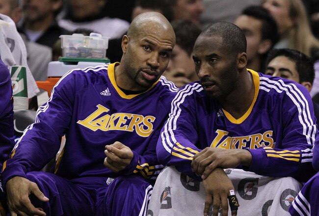 SAN ANTONIO, TX - DECEMBER 28:  Guard Derek Fisher #2 and Kobe Bryant #24 of the Los Angeles Lakers at AT&T Center on December 28, 2010 in San Antonio, Texas.  NOTE TO USER: User expressly acknowledges and agrees that, by downloading and/or using this photograph, user is consenting to the terms and conditions of the Getty Images License Agreement.  (Photo by Ronald Martinez/Getty Images)