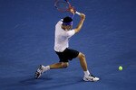 MELBOURNE, AUSTRALIA - JANUARY 22:  Bernard Tomic of Australia plays a backhand in his third round match against Rafael Nadal of Spain during day six of the 2011 Australian Open at Melbourne Park on January 22, 2011 in Melbourne, Australia.  (Photo by Clive Brunskill/Getty Images)
