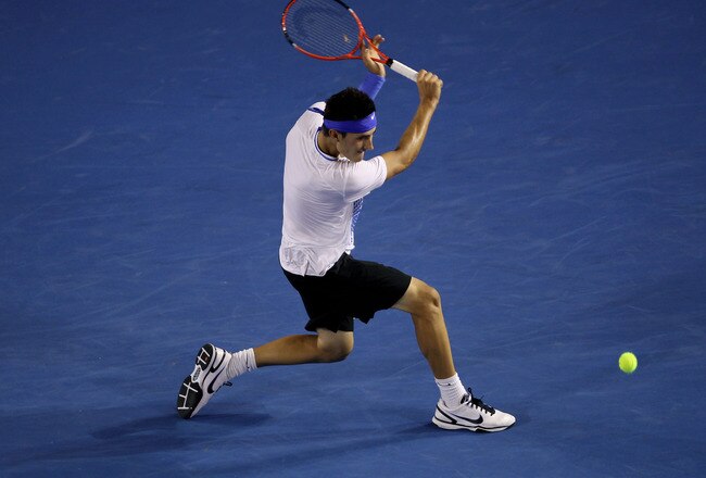 MELBOURNE, AUSTRALIA - JANUARY 22:  Bernard Tomic of Australia plays a backhand in his third round match against Rafael Nadal of Spain during day six of the 2011 Australian Open at Melbourne Park on January 22, 2011 in Melbourne, Australia.  (Photo by Clive Brunskill/Getty Images)