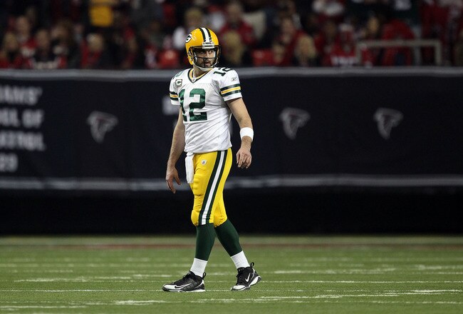 ATLANTA, GA - JANUARY 15:  Aaron Rodgers #12 of the Green Bay Packers looks on against the Atlanta Falcons during their 2011 NFC divisional playoff game at Georgia Dome on January 15, 2011 in Atlanta, Georgia. The Packers won 48-21. (Photo by Streeter Lecka/Getty Images)