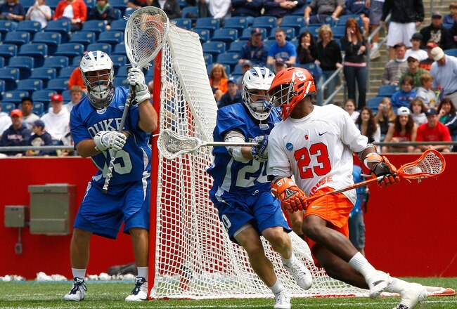 FOXBOROUGH, MA - MAY 23:  Jovan Miller #23 of the Syracuse University Orange presses goalie Rob Schoeder #15 and defender Steve Schoeffel #20 of the Duke University Blue Devils during the semifinal round of NCAA Division I Lacrosse Championship at Gillette Stadium May 23, 2009 in Foxborough, Massachusetts.  (Jim Rogash/Getty Images for Reebok)