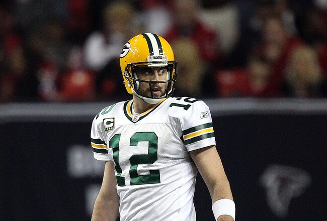 ATLANTA, GA - JANUARY 15:  Aaron Rodgers #12 of the Green Bay Packers looks on against the Atlanta Falcons during their 2011 NFC divisional playoff game at Georgia Dome on January 15, 2011 in Atlanta, Georgia. The Packers won 48-21.  (Photo by Streeter Lecka/Getty Images)