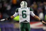 FOXBORO, MA - JANUARY 16:  Mark Sanchez #6 of the New York Jets celebrates after a touchdown late in the fourth quarter against the New England Patriots during their 2011 AFC divisional playoff game at Gillette Stadium on January 16, 2011 in Foxboro, Massachusetts. The Jets defeated the Patriots 28 to 21.  (Photo by Jim Rogash/Getty Images)
