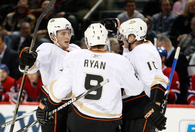 MONTREAL, CANADA - JANUARY 22:  Cam Fowler #4 of the Anaheim Ducks celebrates his first period goal with teammates Bobby Ryan #9 and Corey Perry #10 during the NHL game against the Montreal Canadiens at the Bell Centre on January 22, 2011 in Montreal, Quebec, Canada.  (Photo by Richard Wolowicz/Getty Images)